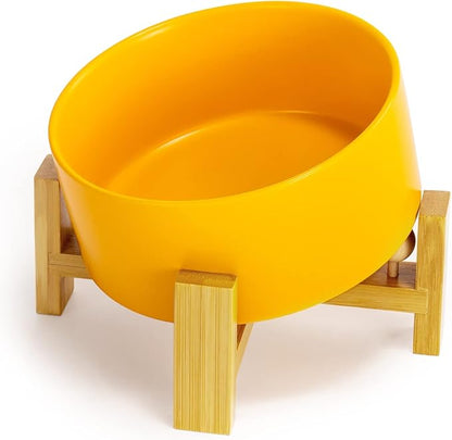 SPUNKYJUNKY 15° Slanted Ceramic Dog and Cat Bowl with Wooden Stand, Tilted Bulldog Food and Water Bowl No Slip Non-Spill for Cats Medium Dogs Big Face Pets 28.7 OZ (3.6 Cups, Yellow)